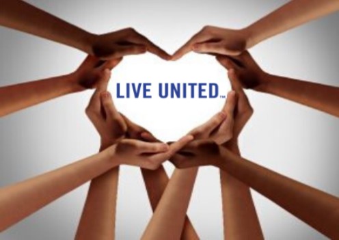 Several hands forming a heart with "Live United" in the center